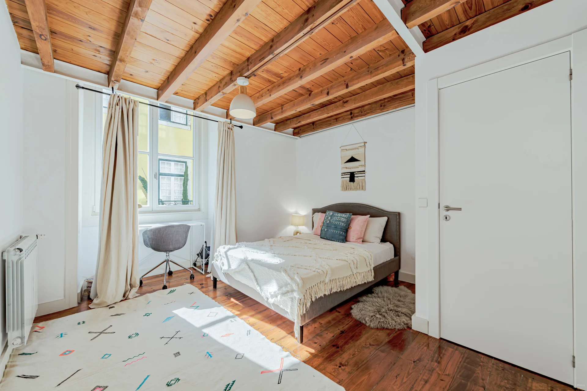 Bedroom with exposed beams